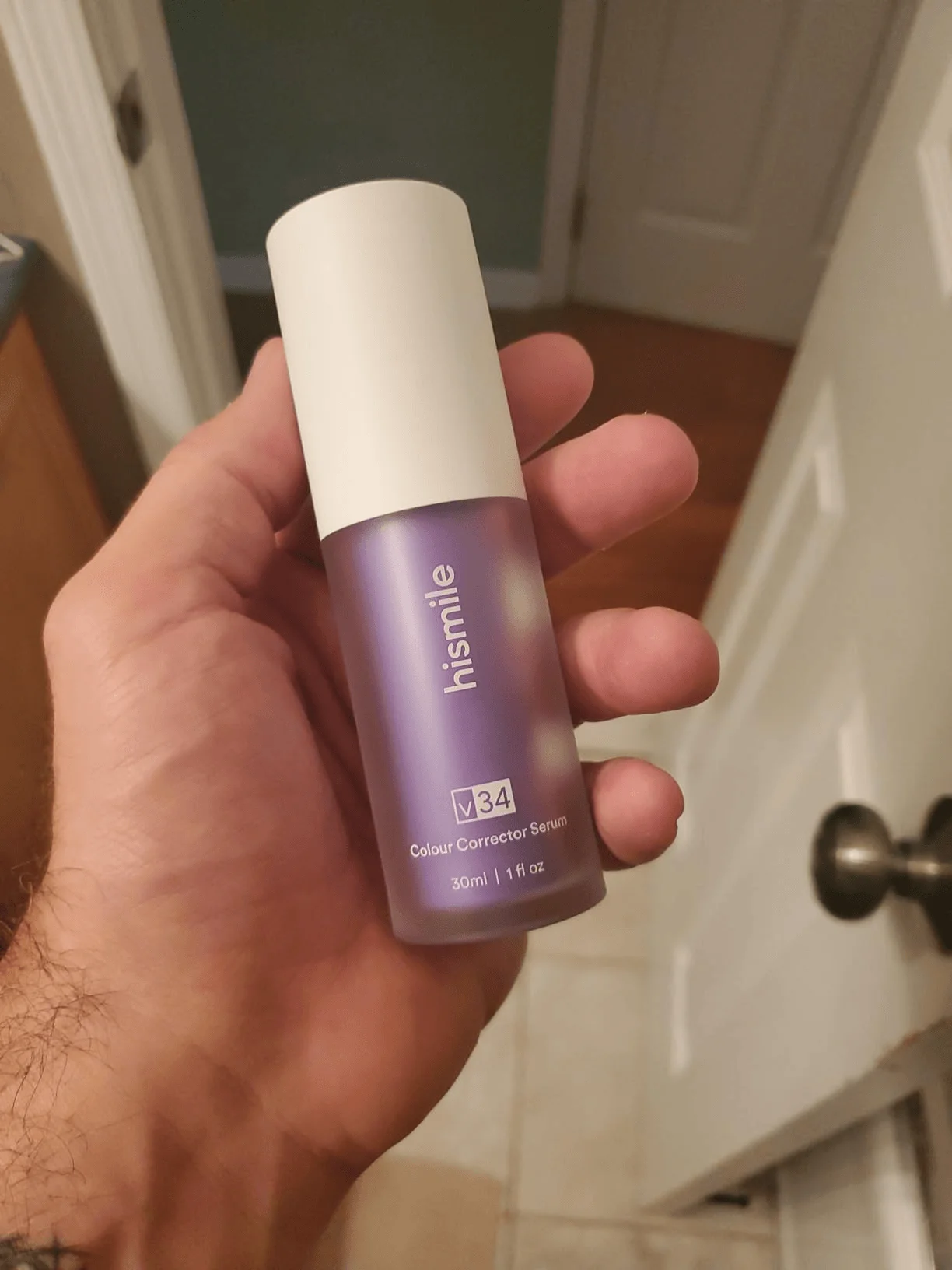 V34 bottle in hand lifestyle image